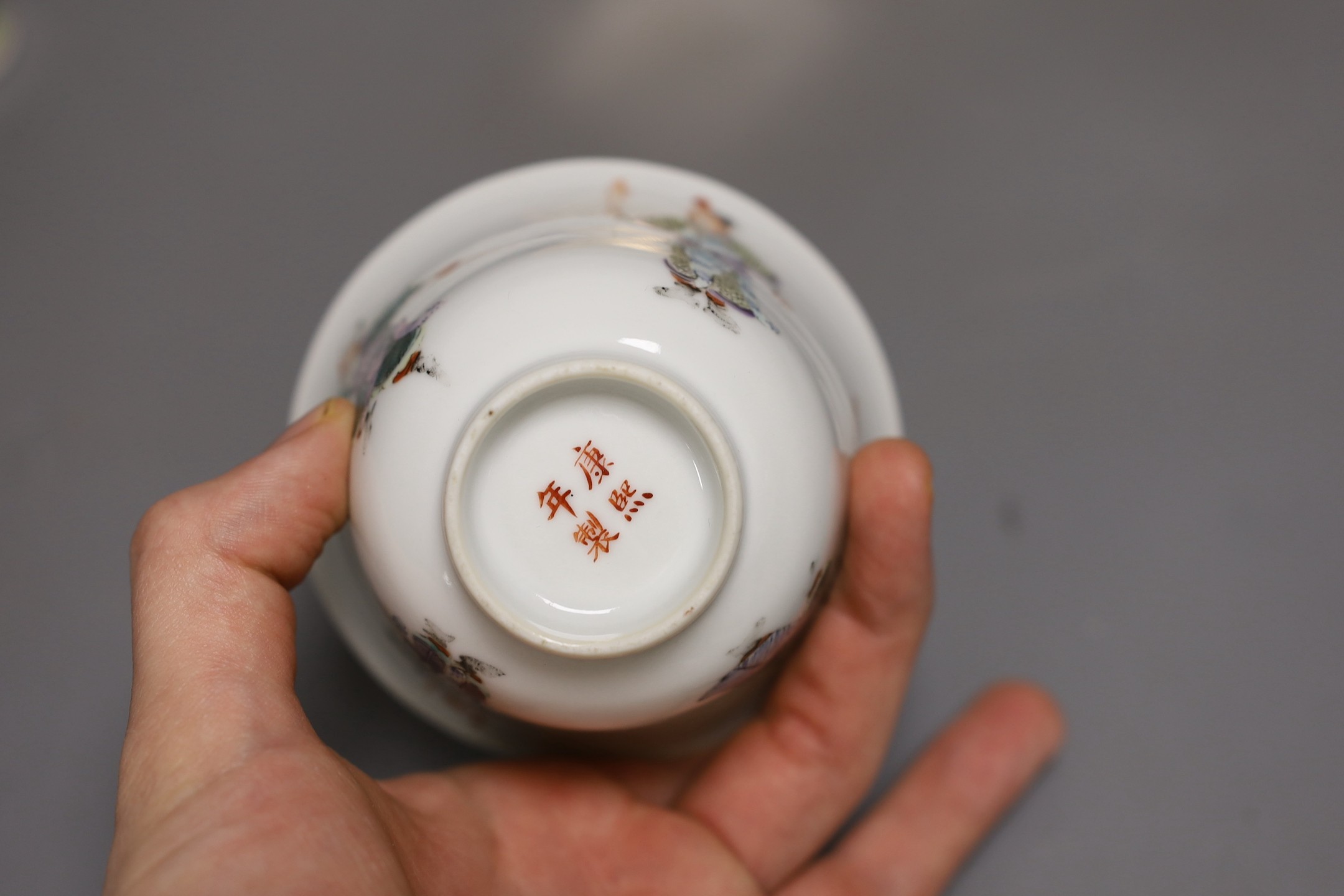 A Chinese famille rose tea bowl, similar small vase and a London shape coffee cup and saucer